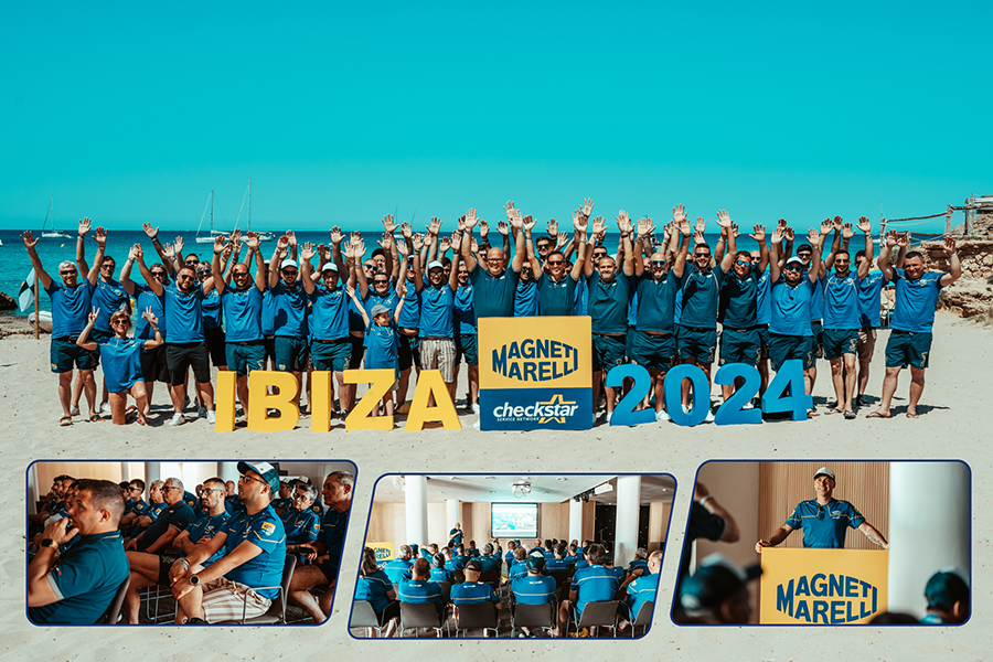 Foto di gruppo sulla spiaggia di Cala Tarida durante il viaggio incentive 2024 a Ibiza, con le officine Magneti Marelli Checkstar e lo staff del Team Magneti Marelli Checkstar
